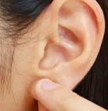 Stretching Earlobe
(How To keep Earbuds in while running)